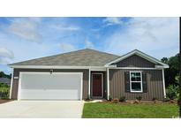 Charming single-story home with a two-car garage and well-manicured lawn at 406 Acosta Circle, Conway, SC 29527