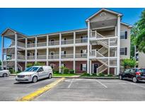 Spacious multi-story condo complex with charming balconies and ample parking on a beautiful day at 1058 Sea Mountain Hwy. # 4-203, North Myrtle Beach, SC 29582