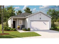 Charming single-story home featuring a two-car garage, well-maintained lawn, and welcoming front porch at 1171 Silver Perch Place, Sunset Beach, NC 28468