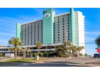 Exterior facade of the Royal Garden Resort showcasing its oceanfront location and multiple floors with private balconies at 1210 N Waccamaw Dr. # 305, Murrells Inlet, SC 29576