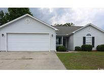 Charming single-story home with a well-maintained front yard, a two-car garage, and great curb appeal at 233 Oak Lea Dr., Conway, SC 29526