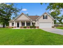 Charming single-Gathering home with a well-manicured lawn and inviting front porch at 2505 Suzanne Dr., Conway, SC 29526