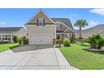 Charming home featuring a well-manicured lawn and a spacious driveway, offering curb appeal at 5146 Fairmont Ln., Myrtle Beach, SC 29579
