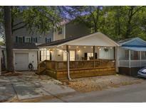 Charming home with a beautiful wooden porch and string lights, perfect for relaxing outdoors at 6001 - 1732 S Kings Hwy., Myrtle Beach, SC 29575