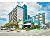 Attractive Landmark Resort building with palm trees and well-maintained landscaping at 1501 S Ocean Blvd. # 1232, Myrtle Beach, SC 29577