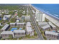 Beautiful aerial view of a beach community with condos, tennis courts, and easy access to the beach at 207 N 3Rd Ave. N # 247, North Myrtle Beach, SC 29582