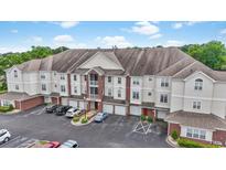 Spacious townhome with red brick and neutral siding, a garage, and ample parking in front at 2241 Waterview Dr. # 532, North Myrtle Beach, SC 29582