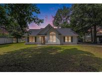Charming single-story home featuring a well-manicured lawn and classic architectural details, creating a welcoming curb appeal at 3429 Mishoe St., Loris, SC 29569
