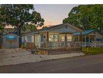 Charming single-story home with a large front porch perfect for enjoying the outdoors at 6001-5742 S Kings Hwy., Myrtle Beach, SC 29575