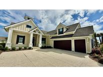 Beautiful single-Gathering home with a three-car garage and well-maintained landscaping at 7040 Belancino Blvd., Myrtle Beach, SC 29572
