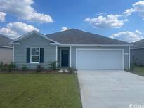 Charming single-story home with a well-manicured lawn and a classic two-car garage at 78 Ashworth Dr., Tabor City, NC 28463