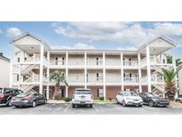 Three story condo building featuring brick facade, off-street parking and convenient exterior staircases at 1058 Sea Mountain Hwy. # 3-201, North Myrtle Beach, SC 29582