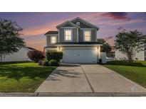 Charming two-story home featuring a two-car garage, well-maintained lawn, and neatly trimmed hedges at 1209 Eagle Creek Dr., Myrtle Beach, SC 29588