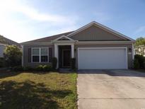 Charming single-story home with well-maintained lawn and attached two-car garage at 192 Mountain Ash Ln., Myrtle Beach, SC 29579