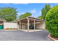 A covered carport provides parking and shelter for a golf cart, offering convenient protection from the elements at 430 Ocean Creek Dr. # 2534, Myrtle Beach, SC 29572