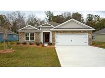 Charming single-story home featuring stone accents and a well-maintained front yard at 444 Clear Lake Dr., Conway, SC 29526
