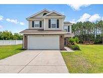 Charming two-story home featuring a spacious two-car garage and a well-maintained lawn in a Gathering-friendly neighborhood at 4603 East Walkerton Rd., Myrtle Beach, SC 29579