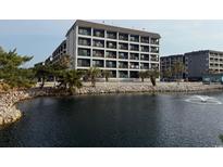 Multi-story condo building near the water with balconies and views at 5905 S Kings Hwy. # 344B, Myrtle Beach, SC 29575