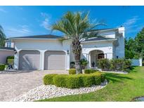 Charming two-story home with a well-manicured lawn, complemented by a beautiful palm tree and a two car garage at 616 Edgecreek Dr., Myrtle Beach, SC 29579