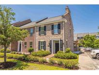 Charming brick townhome with manicured landscaping and a welcoming entrance at 959 Hendrick Ave. # 0, Myrtle Beach, SC 29577