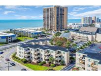 Coastal condos featuring balconies, lush landscaping, and ocean views in a vibrant community at 9661 Shore Dr. # A1, Myrtle Beach, SC 29572