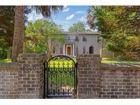 Charming two-story home with a brick facade and an ornate wrought iron gate at 1140 Waterway Ln., Myrtle Beach, SC 29572