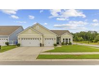Charming single-story home featuring a well-manicured lawn and a two-car garage at 2300 Lark Sparrow St., Myrtle Beach, SC 29577
