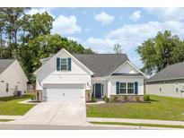 Charming single-Gathering home with a well-manicured lawn, two-car garage, and inviting curb appeal at 2609 Seaport Circle, Georgetown, SC 29440
