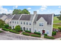 Lovely townhouse community with manicured landscaping, convenient parking, and close proximity to a golf course at 4574 Girvan Dr. # D, Myrtle Beach, SC 29579