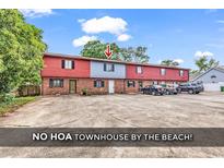 Townhouse exterior with brick and siding, showcasing its multi-Gathering design and ample parking space at 633 Sparrow Dr. # B, Surfside Beach, SC 29575