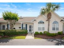 Inviting home with a well-manicured lawn, mature trees, and a charming exterior at 908 Wrigley Dr. # 17-3_17-3G, Myrtle Beach, SC 29588