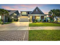 Charming home featuring a neatly landscaped front yard and a welcoming front porch with rocking chairs at 1145 Captain Hooks Way, North Myrtle Beach, SC 29582