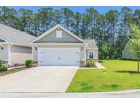 Charming single-Gathering home featuring an attached garage and well-manicured lawn in a desirable neighborhood at 2020 Willow Run Dr. # D, Little River, SC 29566