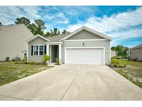 Charming single-story home with a two-car garage and well-maintained front yard at 2315 Blackthorn Dr., Conway, SC 29526