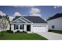 Charming one-story home with a well-manicured lawn and attached garage at 245 Nw Mayflower Dr., Calabash, NC 28467