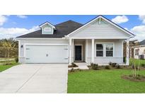 Charming single-Gathering home features a well-manicured lawn and a two-car garage at 2700 Tranquility Loop, Longs, SC 29568