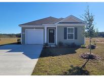 Charming single-story home with a one-car garage and well-maintained lawn on a sunny day at 576 Strawberry Field Way, Galivants Ferry, SC 29544