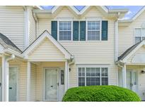 Charming townhome featuring teal shutters, neutral siding, and well-maintained landscaping at 613 S 2Nd Ave. # 21D, North Myrtle Beach, SC 29582