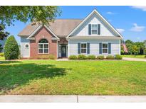 Charming single-Gathering home with manicured lawn and classic architectural details at 1025 Limpkin Dr., Conway, SC 29526