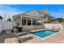 Inviting pool with lounge chairs and grill, perfect for outdoor relaxation and entertaining at 1616 S Ocean Blvd., North Myrtle Beach, SC 29582