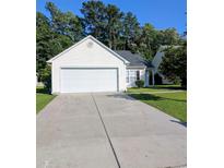 Charming one-story home with a two-car garage and well-maintained front yard at 281 Palmetto Glen Dr., Myrtle Beach, SC 29588
