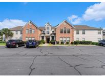 A brick and vinyl multi-Gathering building with ample parking on a sunny day at 4280 Santolina Way # C, Murrells Inlet, SC 29576