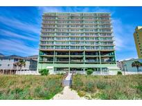 Inviting, upscale condominium building in mint green with a private beach access walkway to the beach at 5310 N Ocean Blvd. # 10B, North Myrtle Beach, SC 29582