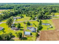 Expansive aerial view of a single-Gathering home, including a detached garage and the surrounding, lush green landscape at 5589 Highway 668, Conway, SC 29526