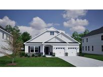 Charming single-Gathering home featuring a two car garage and a well-maintained front yard at 1075 Laconic Dr., Myrtle Beach, SC 29588