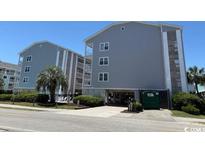 Coastal condo building with ample parking and beach access at 1509 N Waccamaw Dr. # 112, Murrells Inlet, SC 29576