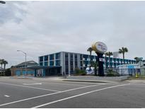 Coastal hotel with a two-story main building and a charming Wave Rider sign at 1600 S Ocean Blvd. S # 150, Myrtle Beach, SC 29577