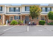 A welcoming condo shows parking spots and green foliage at 210 25Th Ave. S # 19, Myrtle Beach, SC 29577