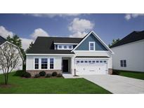 New construction exterior elevation with white siding, brick accents and an attached two car garage at 307 Dunlin Pl, Conway, SC 29526