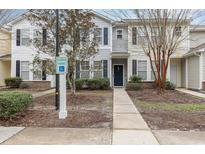 Inviting townhouse with classic curb appeal, featuring neutral siding, walkway and reserved parking for easy access at 310 Kiskadee Loop # D, Conway, SC 29526